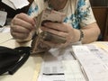 Business woman counting a stack of mexican peso 500 money bills