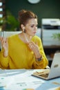 business owner woman in green office having web cam meeting Royalty Free Stock Photo