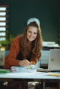 business owner woman in green office working with documents Royalty Free Stock Photo