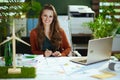 business owner woman in green office working with documents Royalty Free Stock Photo