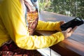 Business owner young 25 s Muslim woman wearing hijab working with payments app smartphone, entrepreneur ready to welcome