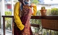 Business owner young 25s Muslim woman wearing hijab working within the restaurant, entrepreneur ready to welcome customers with