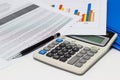 Business paper graphs and pen with charts report, calculator on desk of financial planning Royalty Free Stock Photo