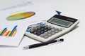 Business paper graphs and pen with charts report, calculator on desk of financial planning Royalty Free Stock Photo