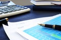 Business papers on an office desk. Financial report.