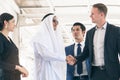 Business partner meeting. Arabian investor shaking hands with young businessman in conference meeting to be partnership Royalty Free Stock Photo