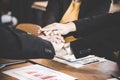 Business partner people joining hand after contract finished meeting.