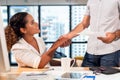 Business partner woman and man joining and stack hand together after contract finished meeting. Royalty Free Stock Photo