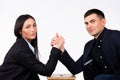 Business partners are competing and looking at the camera. Arm wrestling on a white background. Royalty Free Stock Photo