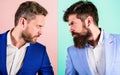 Business partners competitors or office colleagues in suits with tense bearded faces close up. Hostile or argumentative