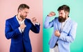 Business partners competitors or office colleagues in suits with tense faces ready to fight. Hostile or argumentative Royalty Free Stock Photo