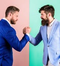 Business partners competitors office colleagues tense faces ready to compete in arm wrestling. Hostile or argumentative Royalty Free Stock Photo