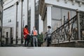 Business partners discussing plans outside an office building