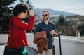 Business partners discussing project details during outdoor meeting in urban city setting Royalty Free Stock Photo