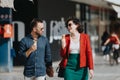 Business partners having an informal meeting while enjoying ice cream outdoors in the city Royalty Free Stock Photo