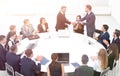 Business partners shake hands at the talks near the round table Royalty Free Stock Photo