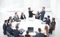 Business partners shake hands at the talks near the round table Royalty Free Stock Photo