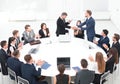 Business partners shake hands at the talks near the round table Royalty Free Stock Photo