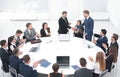 Business partners shake hands at the talks near the round table Royalty Free Stock Photo