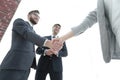 Business partners shaking hands in meeting hall Royalty Free Stock Photo