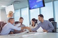 Business partners shaking hands in metting Royalty Free Stock Photo