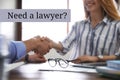 Business partners shaking hands at table in office. Need a lawyer Royalty Free Stock Photo