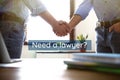 Business partners shaking hands at table in office. Need a lawyer Royalty Free Stock Photo