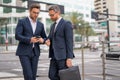 Business partners talking outdoor. Two businessmen discussing outdoor. Two business people talk project strategy. Two Royalty Free Stock Photo