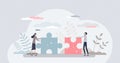 Business partners teamwork with two jigsaw puzzle pieces tiny person concept Royalty Free Stock Photo