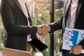 Two confident business man shaking hands during a meeting in the office, success, and partner Royalty Free Stock Photo