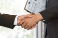 Business partnership successful agreement deal concept. Close up hands two ceo of company shaking hands after signed  contract. Royalty Free Stock Photo