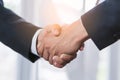 Business partnership successful agreement deal concept. Close up hands two ceo of company shaking hands after signed  contract. Royalty Free Stock Photo