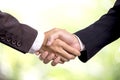 Business partnership successful concept, businessman handshake on bokeh background Royalty Free Stock Photo
