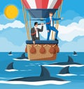 Business people on air balloon, shark in water.