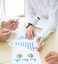 Business People Analyzing Financial Results on Graphs around the Table in Modern Office. Team Work Concept Royalty Free Stock Photo