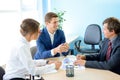 Business People Analyzing Financial Results on Graphs around the Table in Modern Office. Team Work Concept Royalty Free Stock Photo