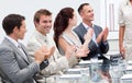 Business people applauding a colleague Royalty Free Stock Photo