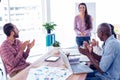 Business people applauding for female coworker Royalty Free Stock Photo