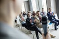 Business people applauding for public speaker during seminar at convention center Royalty Free Stock Photo