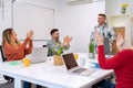 Business people applauding their colleague project presentation in the meeting room. Royalty Free Stock Photo