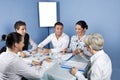 Business people around a table at meeting Royalty Free Stock Photo