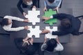 Business people assembling puzzle Royalty Free Stock Photo