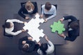 Business people assembling puzzle Royalty Free Stock Photo