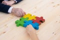 Business people assembling puzzle Royalty Free Stock Photo