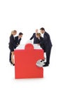 Business people assembling puzzle Royalty Free Stock Photo