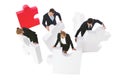 Business people assembling puzzle Royalty Free Stock Photo