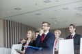 Business people attending seminar in convention center