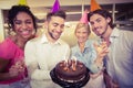 Business people with birthday cake enjoying the party Royalty Free Stock Photo
