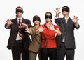 Business people in blindfolds