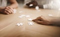 Business people brainstorming solution, problem solving and showing teamwork, working together on puzzle pieces. Team or Royalty Free Stock Photo